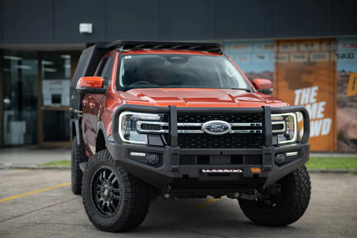 Orange Ford Ranger with a front bullbar
