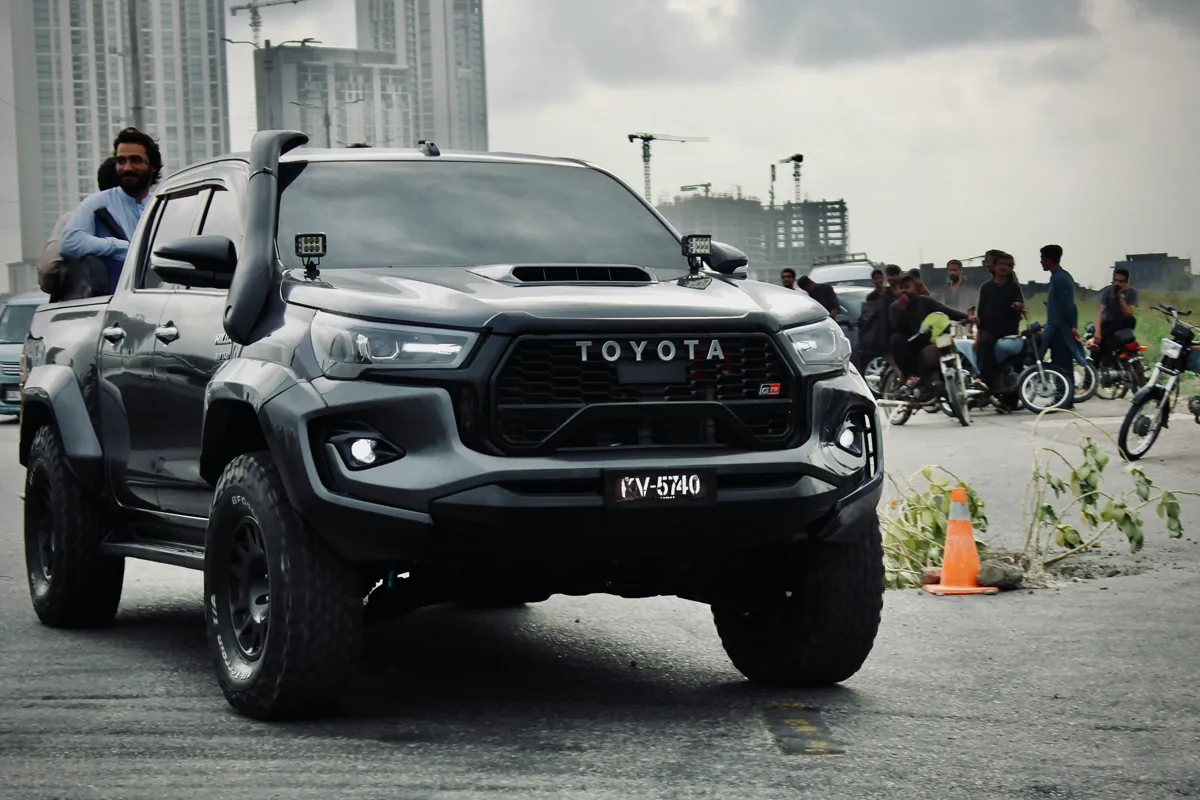 Black Toyota pickup with a snorkel beside the windscreen
